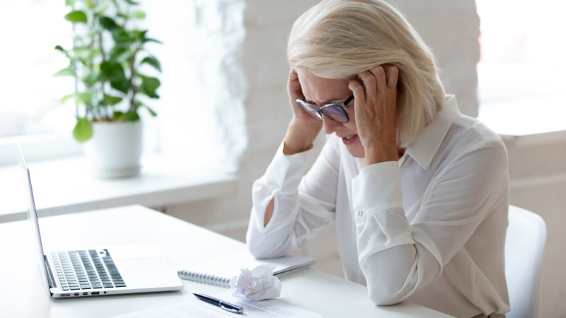 women with blonde hair looking stressed